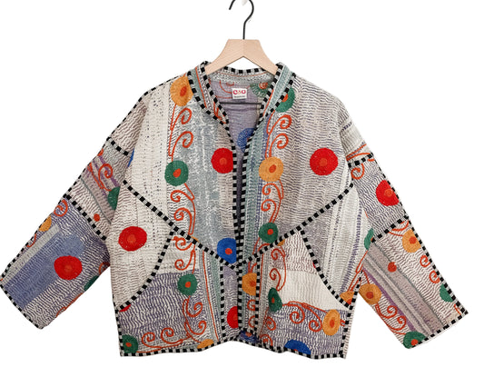 Confetti Patchwork Jacket, one-of-a-kind women's vintage quilt jacket in soft gray, lavender and dusty blue with red, green, marigold and cobalt embroidered medallions and black and white striped piping
